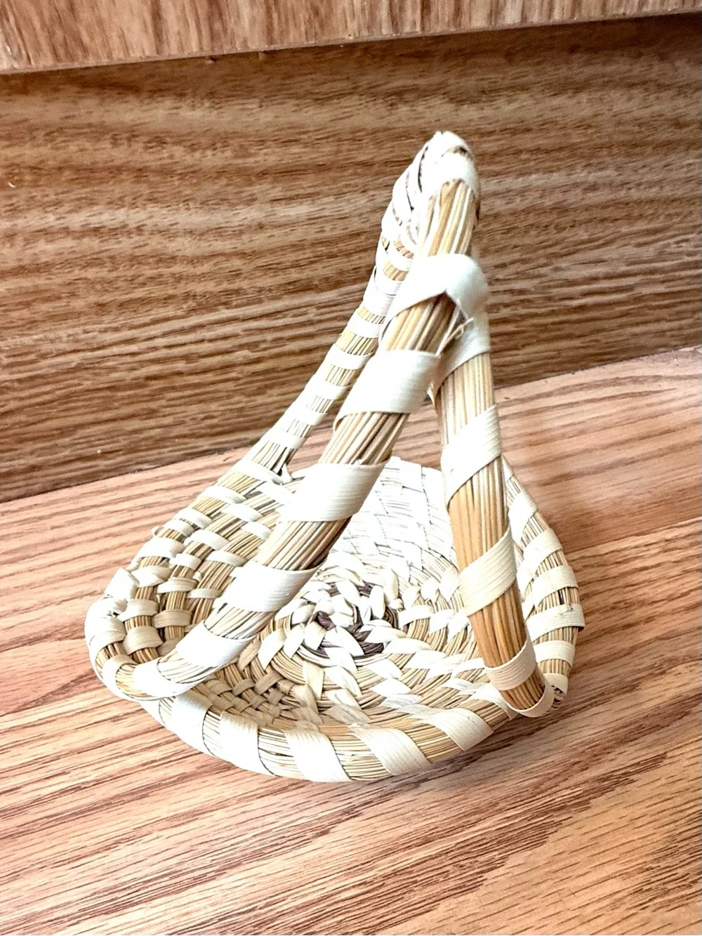 Atraditional hand-woven sweetgrass basket